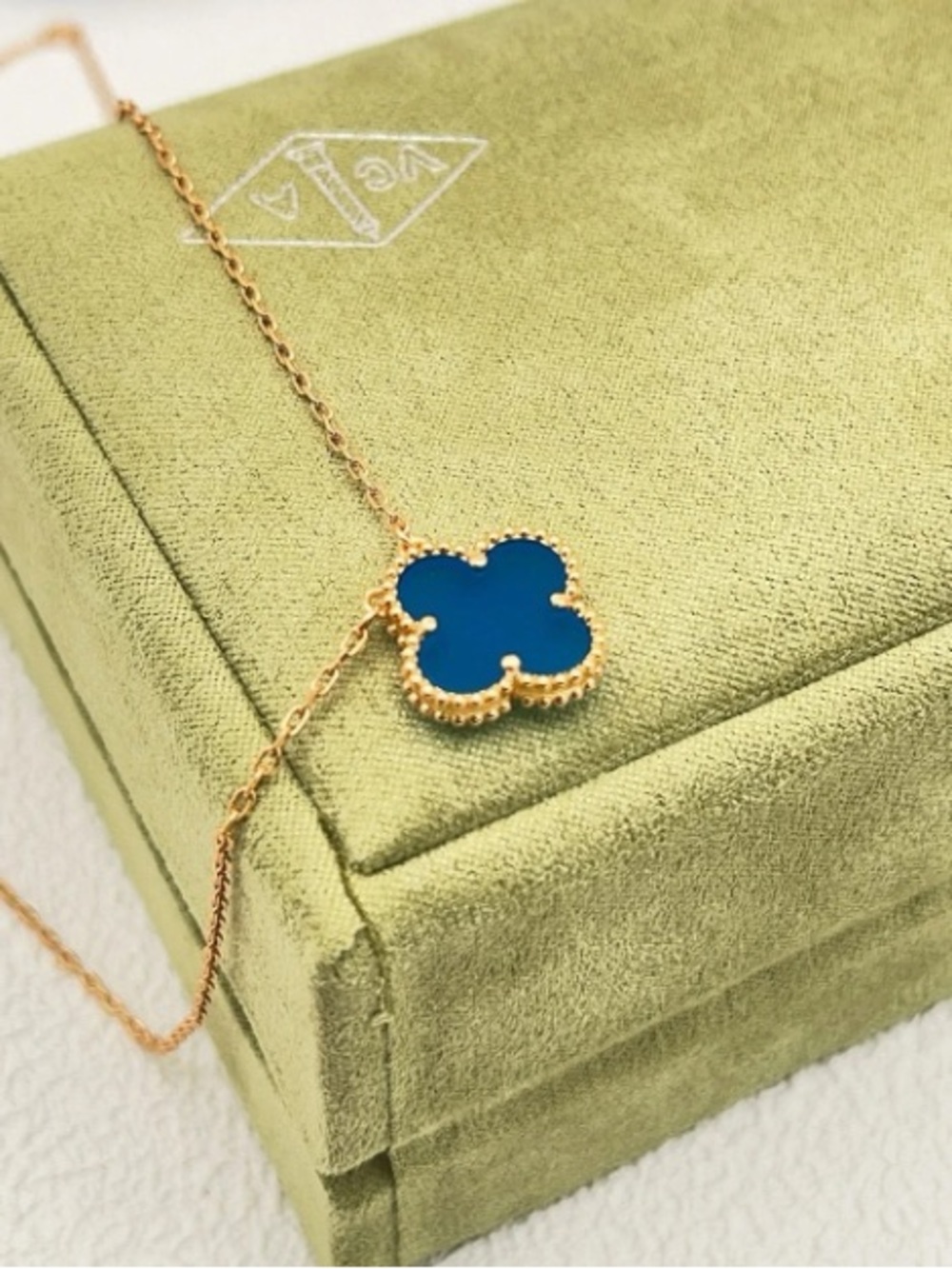 Gold-Tone Necklace with Blue Four-Leaf Motif